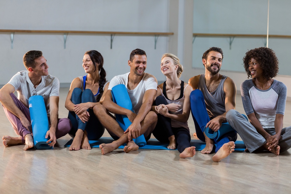 Group of people sitting on floor in fitness studio.jpeg